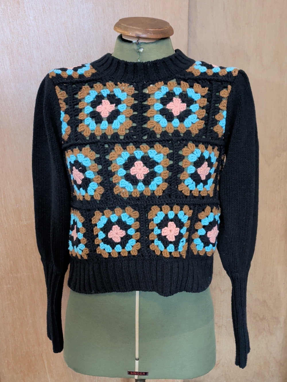 Black Crewneck Sweater with Pink, Blue & Brown Crochet Squares